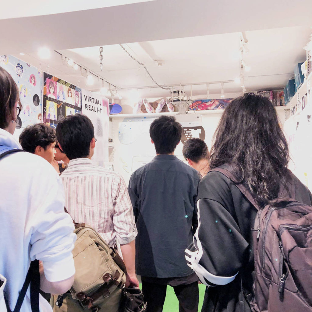 A crowd gathers inside PARK Harajuku for the VIRTUAL REALI-T event